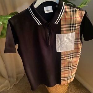Burberry kids polo shirt in black 100% cotton shirt is in excellent condition.